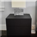 F28. Contemporary three-drawer nightstand. 